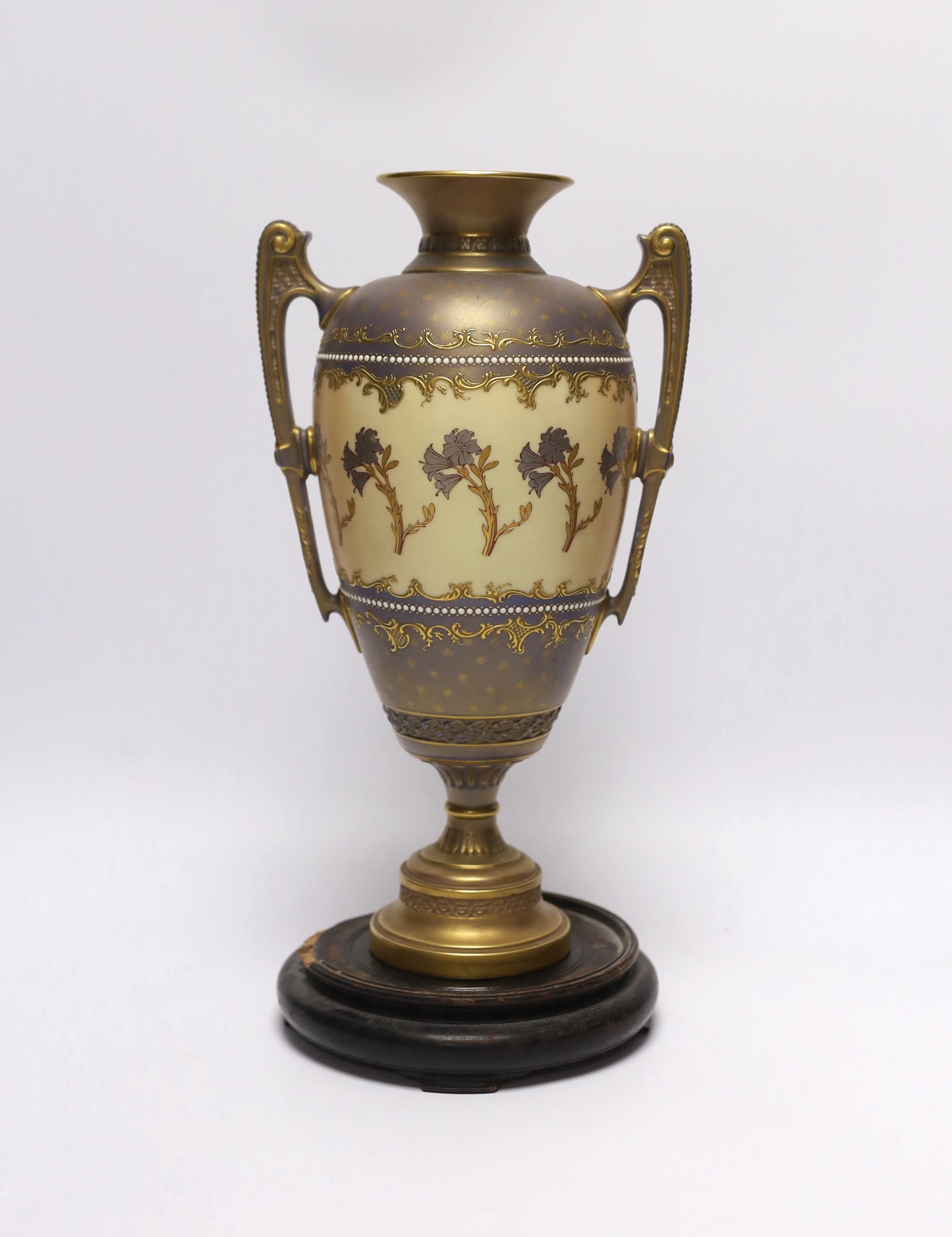 A Royal Worcester blush ivory two handled vase, model no. 1481, with hardwood stand, 31cm